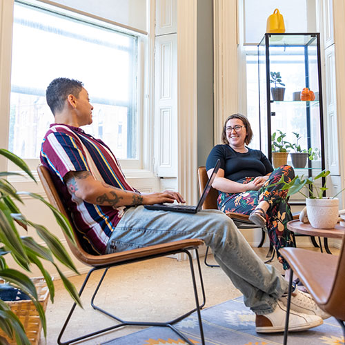 Two people chatting at the Indigenous Student Centre