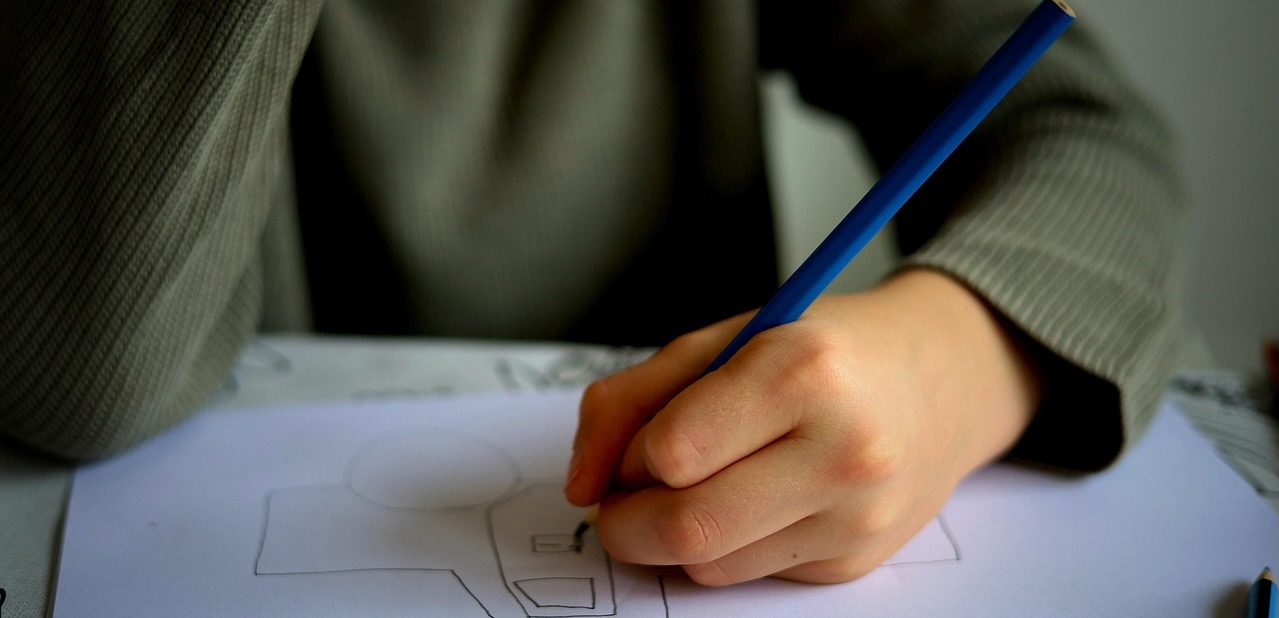 Child drawing on paper.