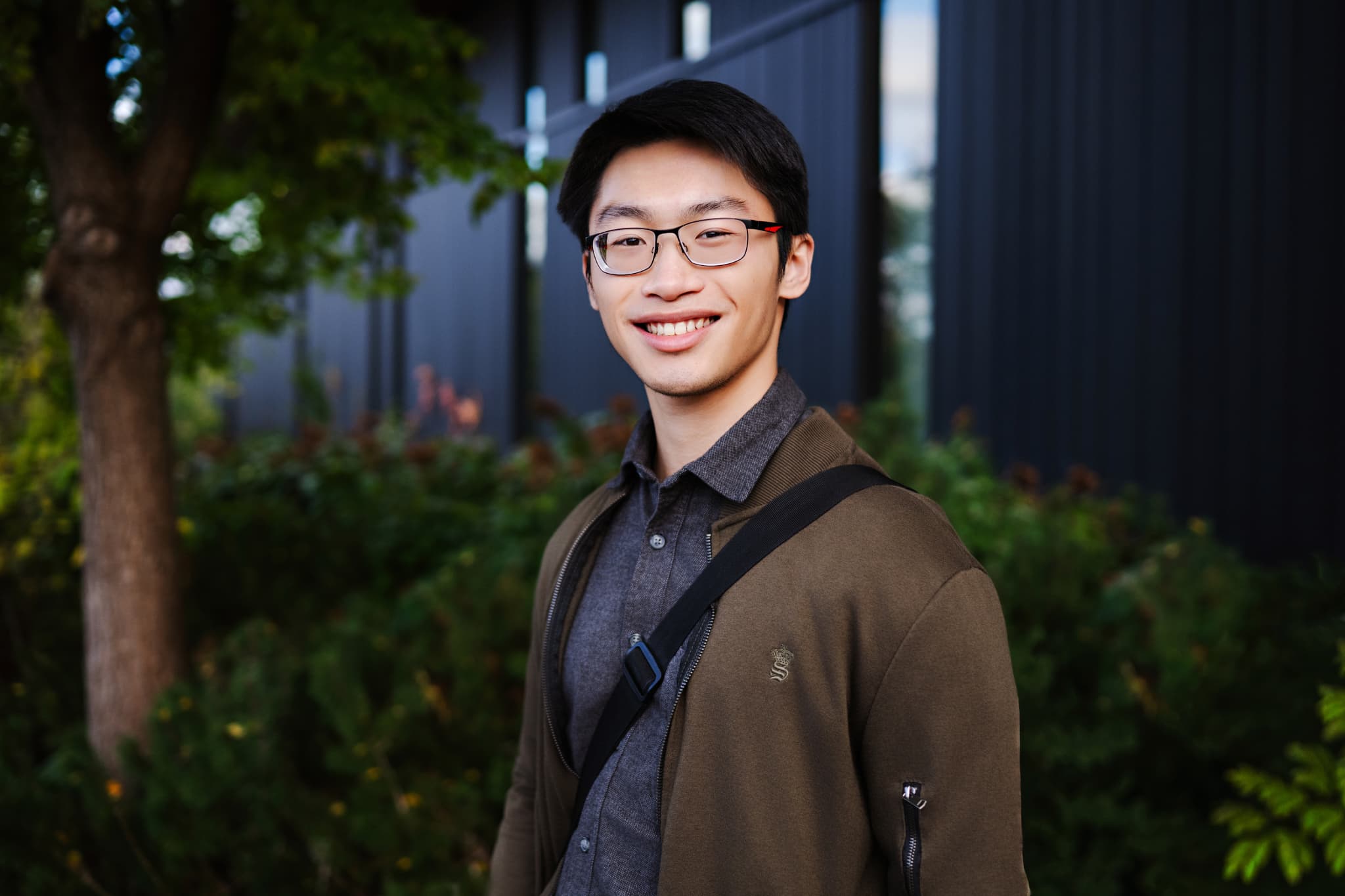 MABE male student standing in front of Lazaridis Hall