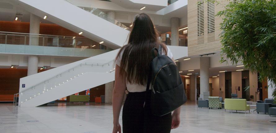 Student walking through Lazaridis Hall