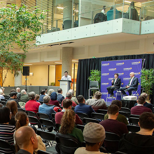Audience listening to speaker on stage
