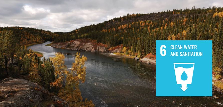 A river flows through treed hills. A text box overlays the photo with copy that reads 6 Clean Water and Sanitation.