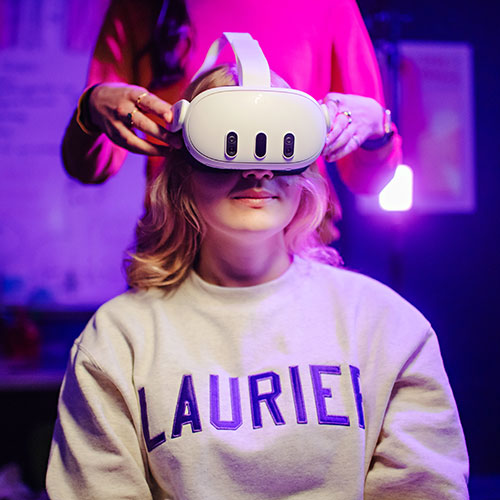 student researcher wears a VR headset