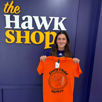 Arrianna Carello poses with her orange shirt design
